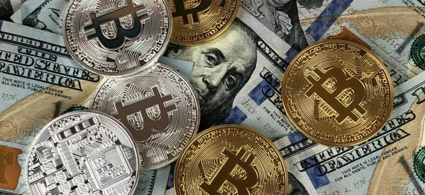 Close-up of bitcoins and US dollar bills symbolizing modern finance and cryptocurrency.