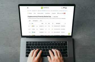 a person's hands on a laptop