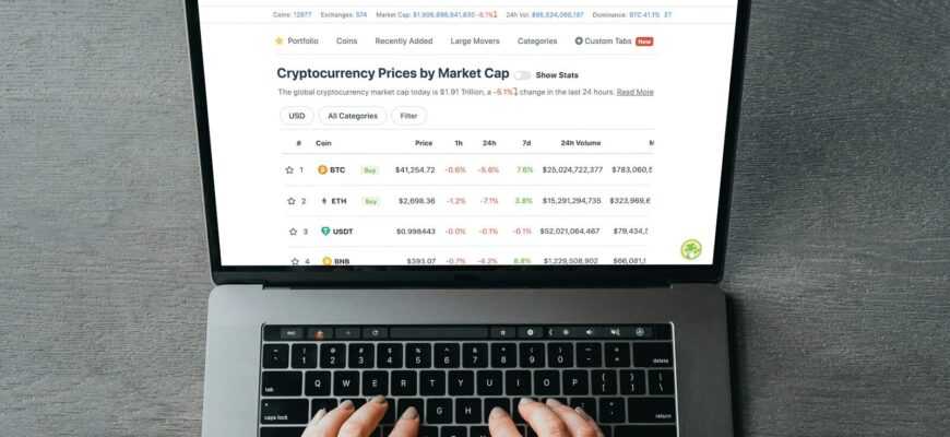 a person's hands on a laptop