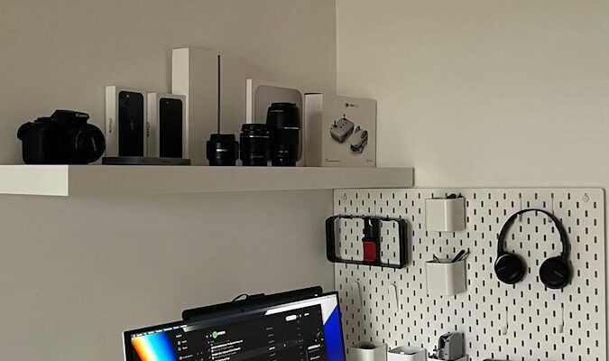 a white desk with a computer on top of it