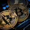 three bitcoins sitting on top of a computer motherboard