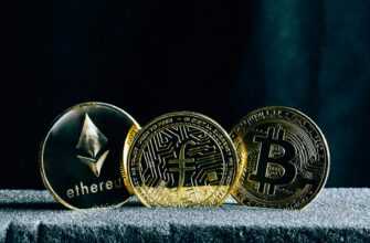 three bitcoins sitting on top of a table