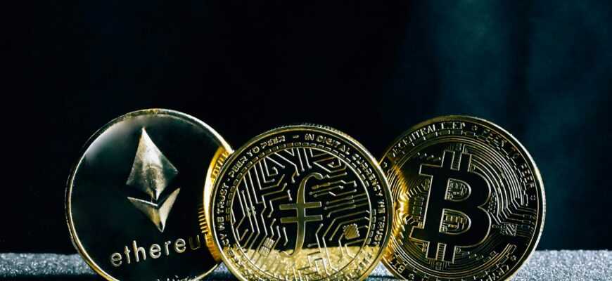 three bitcoins sitting on top of a table